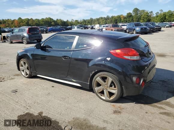 2013 Hyundai Veloster Turbo с VIN KMHTC6AE0DU148225, выставлен на аукционе Copart как лот 80101495 с пробегом 140 047 миль миль и Чистый • Clean title. История ставок и продаж доступна на DreamBid. Изображение 2.