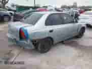 2003 Hyundai Accent GL z VIN KMHCG45C93U496234, wystawiony jako IAAI lot #38787449 z przebiegiem 191 590 mil mil oraz . Historia ofert i sprzedaży dostępna na DreamBid. Obrazek 4.