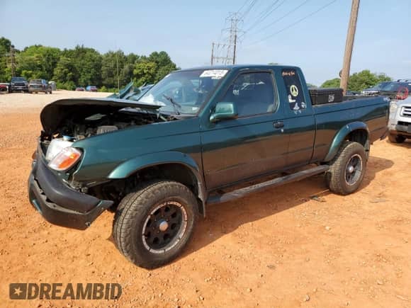 2000 Nissan Frontier XE with VIN 1N6ED26TXYC332543, listed as a Copart auction lot 64014015 with 186,261 mi miles and Salvage title. Bid and sale history available at DreamBid. Image 1.