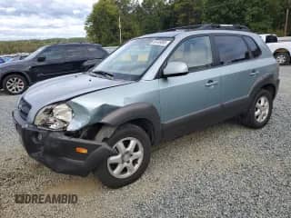 2005 Hyundai Tucson GLS with VIN KM8JN12D55U195746, listed as a Copart auction lot 82449895 with 239,010 mi miles and Salvage title. Bid and sale history available at DreamBid. Image 1.