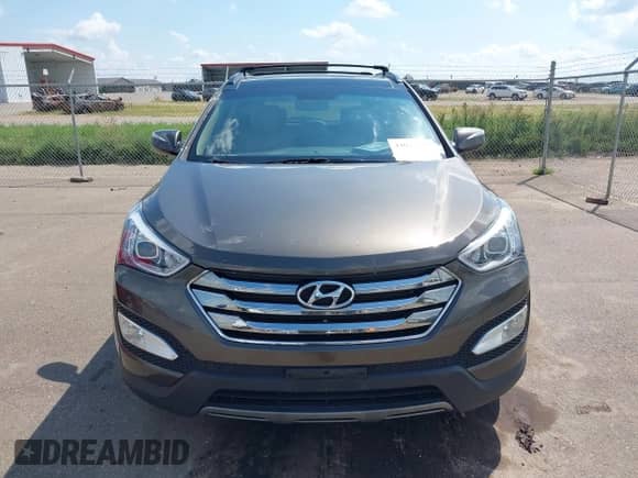 2014 Hyundai Santa Fe z VIN 5XYZUDLB1EG227778, wystawiony jako IAAI lot #43033757 z przebiegiem 135 496 mil mil oraz . Historia ofert i sprzedaży dostępna na DreamBid. Obrazek 12.