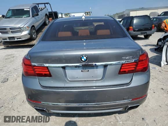 2014 BMW 7 Series 740i z VIN WBAYA6C59ED144220, wystawiony jako Copart lot #80545745 z przebiegiem 138 828 mil mil oraz Szkoda całkowita • Salvage title. Historia ofert i sprzedaży dostępna na DreamBid. Obrazek 6.