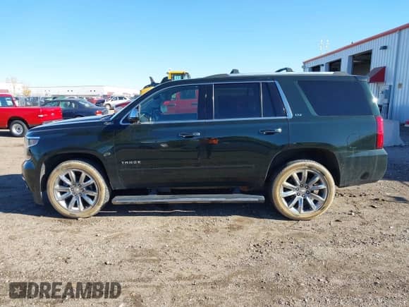 2016 Chevrolet Tahoe LTZ with VIN 1GNSKCKC7GR356857, listed as a IAAI auction lot 43515148 with 159,145 mi miles and . Bid and sale history available at DreamBid. Image 14.