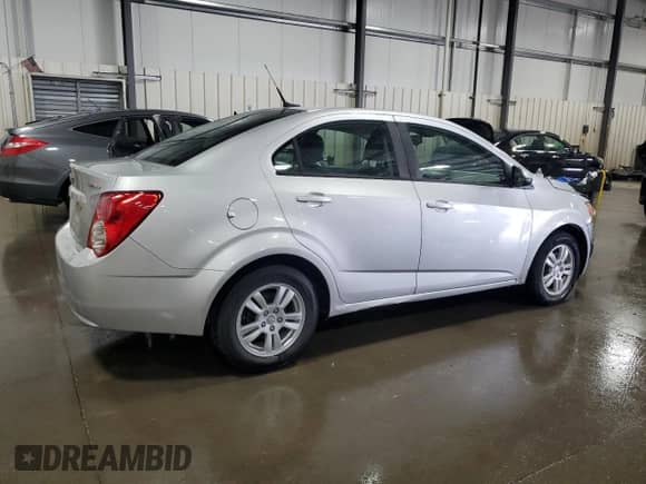 2012 Chevrolet Sonic LS с VIN 1G1JB5SH4C4212002, выставлен на аукционе Copart как лот 54702965 с пробегом 96 388 миль миль и Списание • Salvage title. История ставок и продаж доступна на DreamBid. Изображение 3.