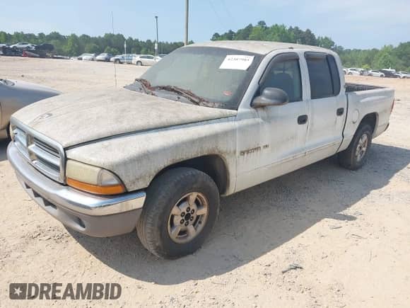 2001 Dodge Dakota Sport z VIN 1B7GL2AN81S101420, wystawiony jako IAAI lot #42387985 z przebiegiem 316 658 mil mil oraz . Historia ofert i sprzedaży dostępna na DreamBid. Obrazek 2.