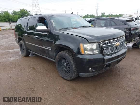 2009 Chevrolet Suburban LTZ z VIN 1GNFK36399R290858, wystawiony jako IAAI lot #42738830 z przebiegiem 214 790 mil mil oraz . Historia ofert i sprzedaży dostępna na DreamBid. Obrazek 1.