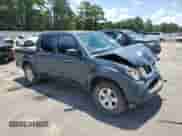 2013 Nissan Frontier SV with VIN 1N6AD0EV9DN710811, listed as a Copart auction lot 66121565 with 122,948 mi miles and Salvage title. Bid and sale history available at DreamBid. Image 4.