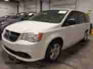 2013 Dodge Grand Caravan SE z VIN 2C4RDGBG4DR533818, wystawiony jako IAAI lot #41981195 z przebiegiem 166 658 mil mil oraz . Historia ofert i sprzedaży dostępna na DreamBid. Obrazek 18.