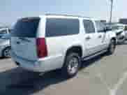 2009 Chevrolet Suburban with VIN 1GNGC46K29R213991, listed as a IAAI auction lot 42066741 with 150,021 mi miles and . Bid and sale history available at DreamBid. Image 4.