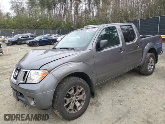 2021 Nissan Frontier Pro-4X with VIN 1N6ED0EB3MN700394, listed as a Copart auction lot 51048235 with 156,875 mi miles and Salvage title. Bid and sale history available at DreamBid. Image 1.