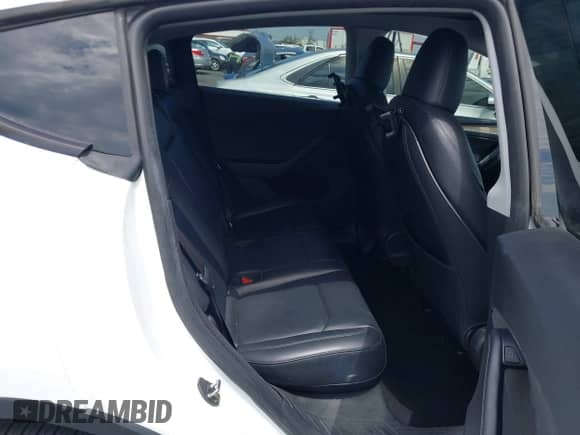 2023 Tesla Model Y Long Range with VIN 7SAYGDEE7PA124885, listed as a IAAI auction lot 43084065 with 22,983 mi miles and . Bid and sale history available at DreamBid. Image 8.