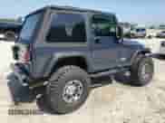 2002 Jeep Wrangler X z VIN 1J4FA39S92P729342, wystawiony jako Copart lot #56130275 z przebiegiem 132 566 mil mil oraz Szkoda całkowita • Salvage title. Historia ofert i sprzedaży dostępna na DreamBid. Obrazek 3.