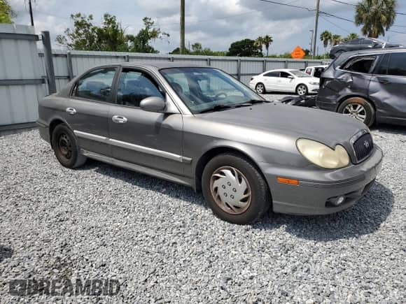2004 Hyundai Sonata with VIN KMHWF25HX4A957069, listed as a Copart auction lot 56349275 with 184,083 mi miles and Salvage title. Bid and sale history available at DreamBid. Image 4.