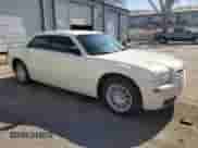 2009 Chrysler 300 LX with VIN 2C3KA43D49H577686, listed as a Copart auction lot 53002035 with 239,337 mi miles and Salvage title. Bid and sale history available at DreamBid. Image 4.