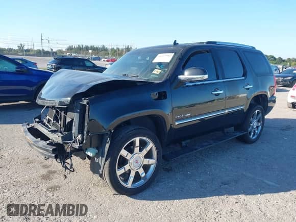 2011 Cadillac Escalade Premium with VIN 1GYS3CEF7BR319516, listed as a IAAI auction lot 41519982 with 174,970 mi miles and . Bid and sale history available at DreamBid. Image 2.