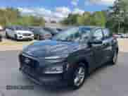 2018 Hyundai Kona SE z VIN KM8K1CAA7JU177889, wystawiony jako IAAI lot #43087670 z przebiegiem 155 774 mil mil oraz . Historia ofert i sprzedaży dostępna na DreamBid. Obrazek 2.