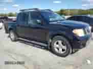 2006 Nissan Frontier SE with VIN 1N6AD07UX6C412495, listed as a Copart auction lot 84879235 with 257,704 mi miles and Salvage title. Bid and sale history available at DreamBid. Image 4.