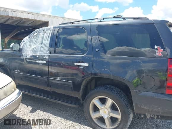2012 Chevrolet Tahoe LT with VIN 1GNSCBE05CR211898, listed as a IAAI auction lot 42612993 with 233,367 mi miles and . Bid and sale history available at DreamBid. Image 14.