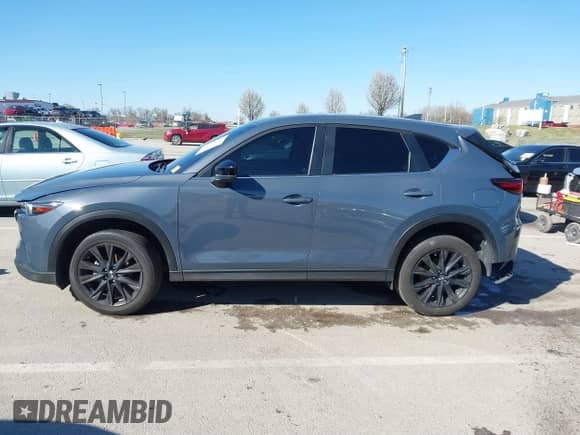 2022 Mazda CX-5 S Carbon Edition z VIN JM3KFBCMXN1619568, wystawiony jako IAAI lot #41828567 z przebiegiem 41 475 mil mil oraz . Historia ofert i sprzedaży dostępna na DreamBid. Obrazek 14.