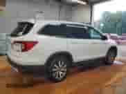 2022 Honda Pilot EX-L with VIN 5FNYF6H51NB033201, listed as a Copart auction lot 66617825 with 62,310 mi miles and Salvage title. Bid and sale history available at DreamBid. Image 3.