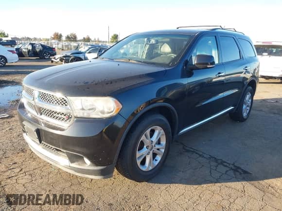 2013 Dodge Durango Crew with VIN 1C4RDJDG0DC674145, listed as a IAAI auction lot 43489425 with 129,527 mi miles and . Bid and sale history available at DreamBid. Image 2.