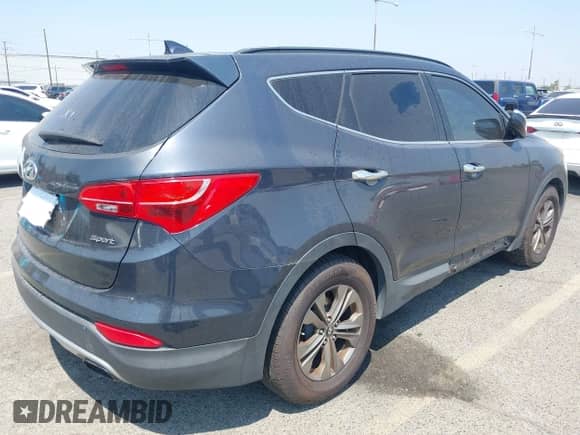 2014 Hyundai Santa Fe with VIN 5XYZU3LB3EG129409, listed as a IAAI auction lot 42987145 with 95,448 mi miles and . Bid and sale history available at DreamBid. Image 4.