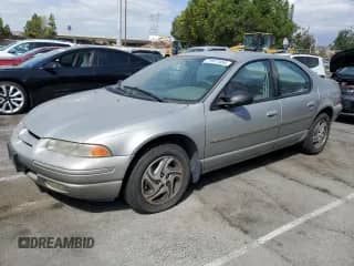 1997 Dodge Stratus ES with VIN 1B3EJ56H0VN679440, listed as a Copart auction lot 71977454 with 83,367 mi miles and Clean title. Bid and sale history available at DreamBid. Image 1.