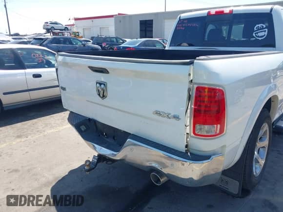 2014 Ram 1500 Laramie z VIN 1C6RR7VM1ES312946, wystawiony jako IAAI lot #42620415 z przebiegiem 163 405 mil mil oraz . Historia ofert i sprzedaży dostępna na DreamBid. Obrazek 6.