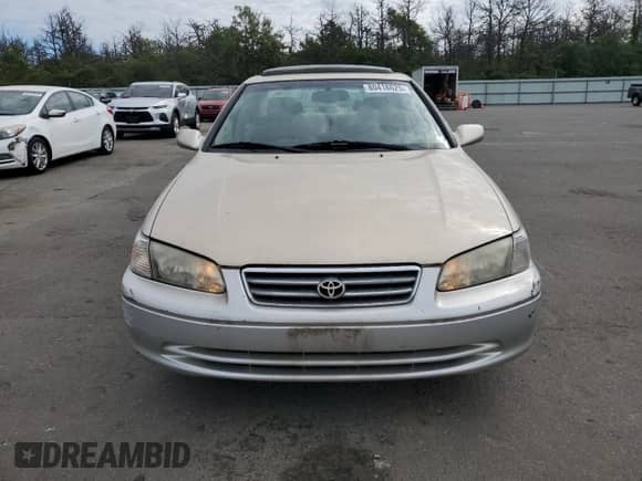 2001 Toyota Camry LE z VIN JT2BF28K410309733, wystawiony jako Copart lot #80418625 z przebiegiem 67 221 mil mil oraz Czysty tytuł • Clean title. Historia ofert i sprzedaży dostępna na DreamBid. Obrazek 5.