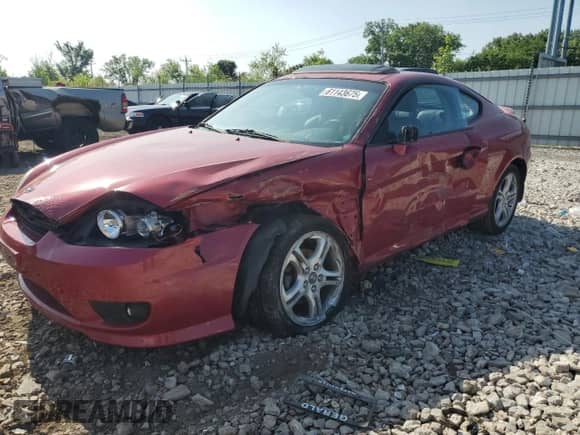 2006 Hyundai Tiburon GT с VIN KMHHN65FX6U190598, выставлен на аукционе Copart как лот 61143675 с пробегом Не указан миль и Списание • Salvage title. История ставок и продаж доступна на DreamBid. Изображение 1.
