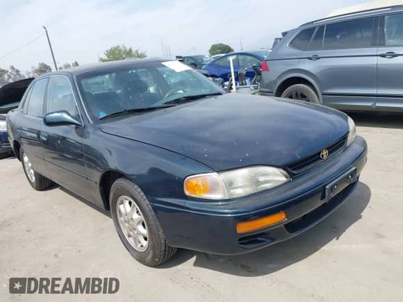 1995 Toyota Camry LE z VIN JT2SK12E1S0330730, wystawiony jako IAAI lot #42916715 z przebiegiem 139 883 mil mil oraz . Historia ofert i sprzedaży dostępna na DreamBid. Obrazek 1.