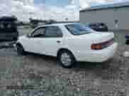 1993 Toyota Camry LE z VIN JT2SK12E6P0100267, wystawiony jako Copart lot #64142305 z przebiegiem 292 298 mil mil oraz Szkoda całkowita • Salvage title. Historia ofert i sprzedaży dostępna na DreamBid. Obrazek 2.