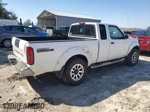 2001 Nissan Frontier SE Desert Runner z VIN 1N6ED26T81C397493, wystawiony jako Copart lot #48936295 z przebiegiem Nie podano mil oraz Szkoda całkowita • Salvage title. Historia ofert i sprzedaży dostępna na DreamBid. Obrazek 3.