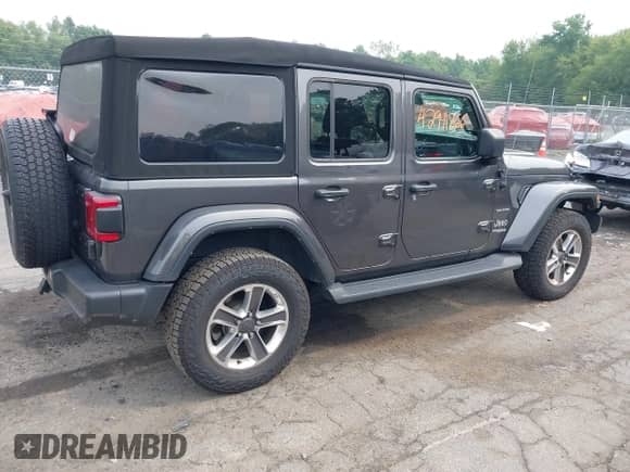 2021 Jeep Wrangler Unlimited Sahara Altitude with VIN 1C4HJXEG7MW776529, listed as a IAAI auction lot 42911866 with 51,748 mi miles and . Bid and sale history available at DreamBid. Image 13.