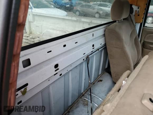 2002 GMC Sierra 1500 z VIN 1GTEC14W12Z170108, wystawiony jako Copart lot #68564144 z przebiegiem Nie podano mil oraz Szkoda całkowita • Salvage title. Historia ofert i sprzedaży dostępna na DreamBid. Obrazek 10.