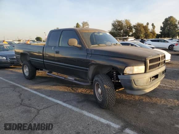 1998 Dodge 2500 with VIN 1B7KF23W5WJ124142, listed as a Copart auction lot 79551844 with 162,747 mi miles and Clean title. Bid and sale history available at DreamBid. Image 4.
