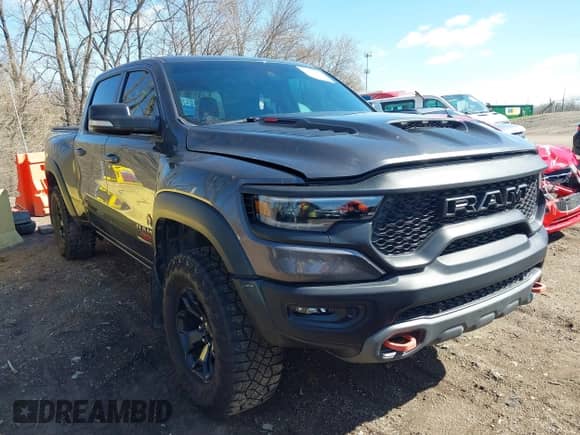 2022 Ram 1500 TRX with VIN 1C6SRFU99NN311731, listed as a IAAI auction lot 41857579 with 20,627 mi miles and . Bid and sale history available at DreamBid. Image 1.
