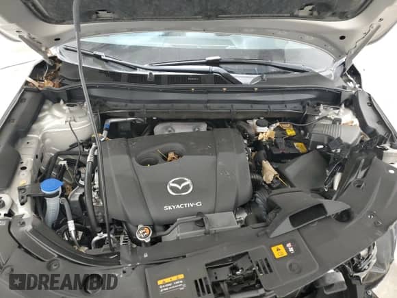 2025 Mazda CX-5 S Select z VIN JM3KFBBLXS0690411, wystawiony jako Copart lot #90328315 z przebiegiem Nie podano mil oraz Szkoda całkowita • Salvage title. Historia ofert i sprzedaży dostępna na DreamBid. Obrazek 12.