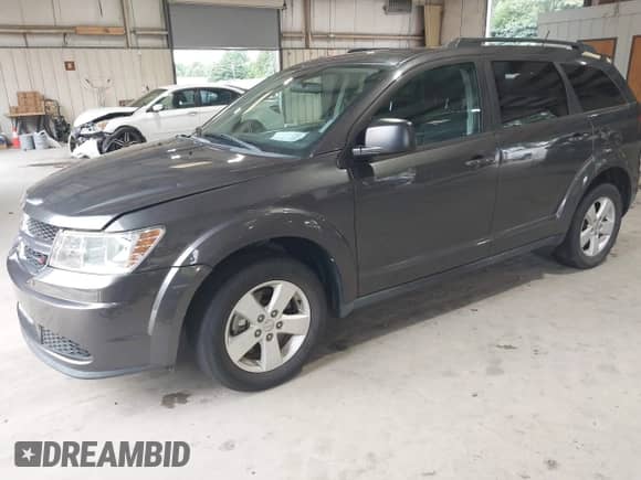 2015 Dodge Journey American Value with VIN 3C4PDCAB1FT744948, listed as a IAAI auction lot 42976982 with 77,765 mi miles and . Bid and sale history available at DreamBid. Image 2.