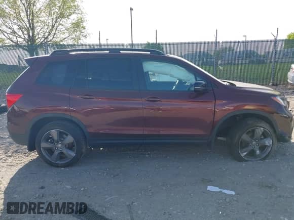 2021 Honda Passport Touring z VIN 5FNYF8H91MB022986, wystawiony jako IAAI lot #42077321 z przebiegiem 20 497 mil mil oraz . Historia ofert i sprzedaży dostępna na DreamBid. Obrazek 13.