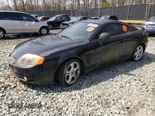 2003 Hyundai Tiburon GT с VIN KMHHN65F13U084620, выставлен на аукционе Copart как лот 46880185 с пробегом Не указан миль и На запчасти • Non repairable. История ставок и продаж доступна на DreamBid. Изображение 1.