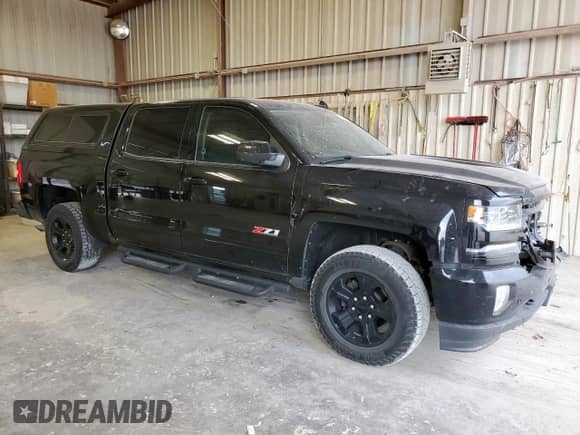 2018 Chevrolet Silverado 1500 LTZ z VIN 3GCUKSEJ5JG635964, wystawiony jako Copart lot #86049035 z przebiegiem 179 676 mil mil oraz Szkoda całkowita • Salvage title. Historia ofert i sprzedaży dostępna na DreamBid. Obrazek 4.