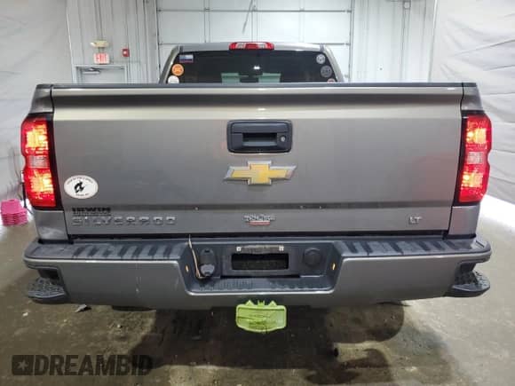 2017 Chevrolet Silverado 1500 LT with VIN 1GCVKREH4HZ249881, listed as a Copart auction lot 62936765 with 71,091 mi miles and Salvage title. Bid and sale history available at DreamBid. Image 6.