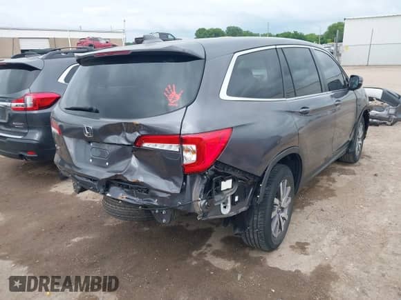 2021 Honda Pilot EX-L z VIN 5FNYF5H57MB027752, wystawiony jako IAAI lot #42470043 z przebiegiem 58 934 mil mil oraz . Historia ofert i sprzedaży dostępna na DreamBid. Obrazek 4.