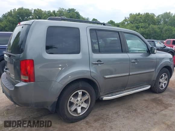 2009 Honda Pilot Touring with VIN 5FNYF48969B031280, listed as a IAAI auction lot 42934690 with 163,844 mi miles and . Bid and sale history available at DreamBid. Image 4.