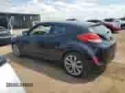 2013 Hyundai Veloster w/Black Int z VIN KMHTC6AD1DU125253, wystawiony jako Copart lot #67401815 z przebiegiem 105 150 mil mil oraz Szkoda całkowita • Salvage title. Historia ofert i sprzedaży dostępna na DreamBid. Obrazek 2.