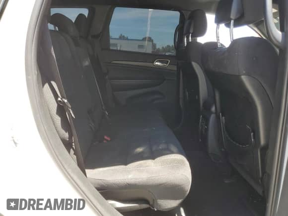2016 Jeep Grand Cherokee Laredo with VIN 1C4RJEAG2GC501025, listed as a Copart auction lot 64325035 with 138,753 mi miles and Salvage title. Bid and sale history available at DreamBid. Image 11.