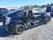 2014 Toyota Prius Three z VIN JTDKN3DU7E1774076, wystawiony jako IAAI lot #43289820 z przebiegiem 139 467 mil mil oraz . Historia ofert i sprzedaży dostępna na DreamBid. Obrazek 4.