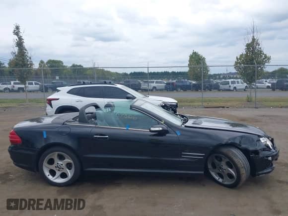 2005 Mercedes-Benz SL 500 z VIN WDBSK75F55F101501, wystawiony jako IAAI lot #43237866 z przebiegiem 136 574 mil mil oraz . Historia ofert i sprzedaży dostępna na DreamBid. Obrazek 13.
