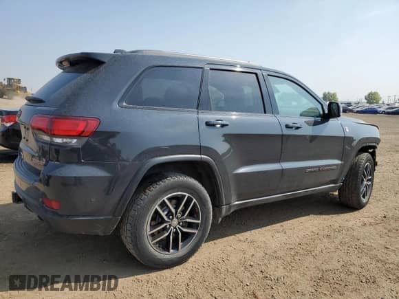 2017 Jeep Grand Cherokee Trailhawk z VIN 1C4RJFLG0HC807936, wystawiony jako Copart lot #71960485 z przebiegiem 143 040 mil mil oraz Szkoda całkowita • Salvage title. Historia ofert i sprzedaży dostępna na DreamBid. Obrazek 3.